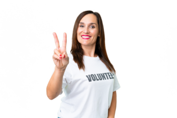Middle age volunteer woman over isolated chroma key background smiling and showing victory sign