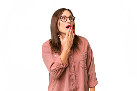 Middle-aged caucasian woman over isolated background yawning and covering wide open mouth with hand