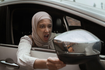 Angry Woman Expressing Frustration While Driving in a Modern Car