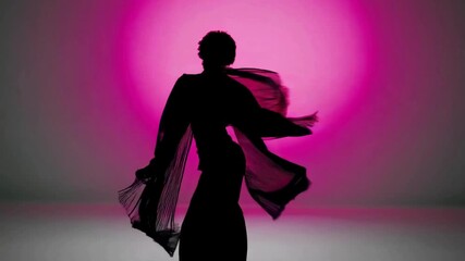 Elegant female dancer with flowing scarf in pink light - Powered by Adobe