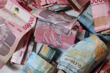 Pile of Indonesian Rupiah Banknotes in Various Denominations Showing Financial Wealth