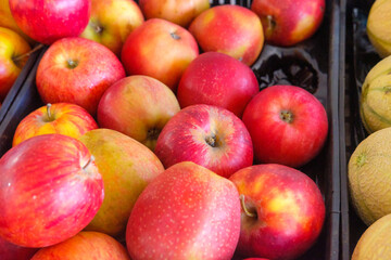 A Mass of Red Apples Creating a Vibrant Background. Concept: The power of a single color.