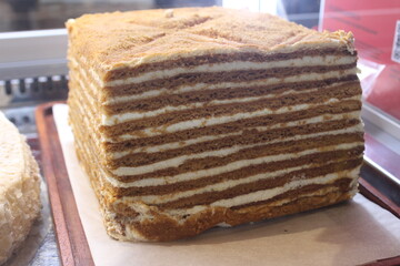 open cake. Layers of cakes and cream close-up side view