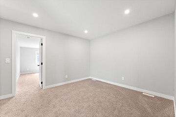 White room with a door leading to another room