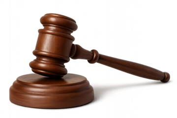 Wooden gavel resting on sounding block against black background