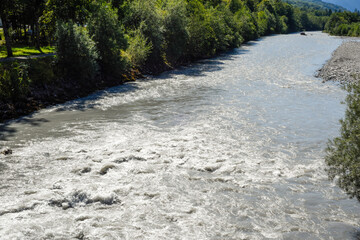 Glacial river winds through a dramatic mountain landscape