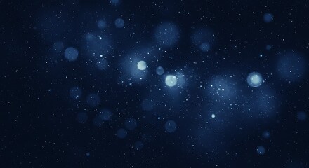 Abstract blue bokeh lights sparkle like stars in a dark night sky