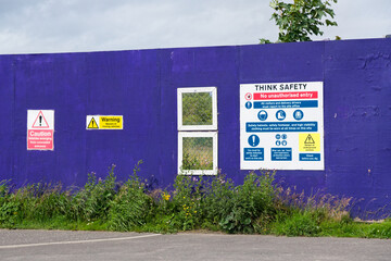 Construction site health and safety sign at entrance
