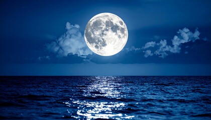 Full moon over the ocean at night