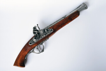 18th century flintlock pirate pistol replica isolated on white background