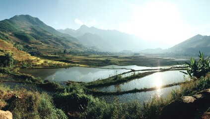 Terraced rice paddies nestled amongst mountains.