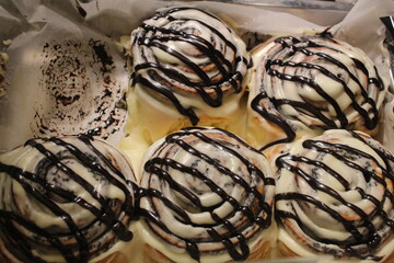 Sinabon buns Cinnabon with cream and chocolate fudge. Top view