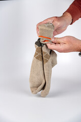 Demonstrating folding socks close up
