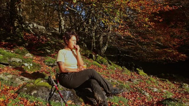 Woman enjoying autumn hike in Gorbea Natural Park