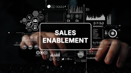 Hands Typing on Keyboard with Sales Enablement Background and Digital Data Graphics for Business...