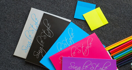 Colored notebook, colored pencils and other learning tools
