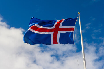 Icelandic flag waving in the wind on a blue sky