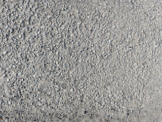 Rough Asphalt Texture: Grey Pavement with Small Stones Background