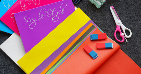 Colored notebook, colored pencils and other learning tools