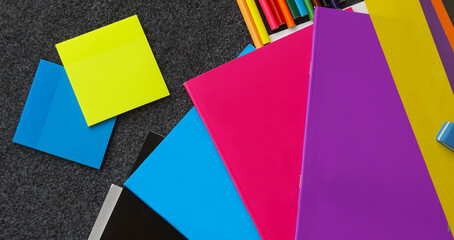 Colored notebook, colored pencils and other learning tools