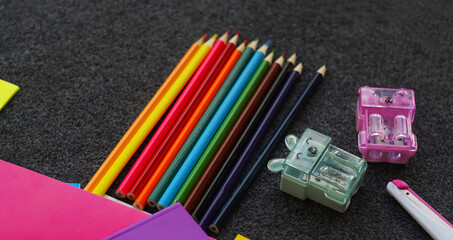 Colored notebook, colored pencils and other learning tools
