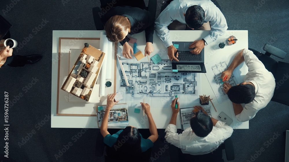 Poster top down aerial view of project manager using laptop to analysis building construction. aerial view 
