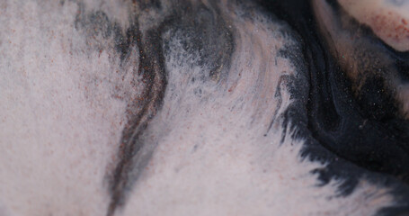 Spatter texture. Spreading ink particles. Defocused orange white color wet drip shiny liquid...