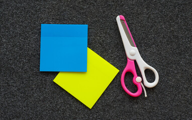 Colored paper and scissors on the table