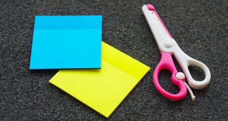 Colored paper and scissors on the table
