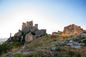 Italy, July 5, 2025: Ruins of Rocca Calascio Castle, an Italian tourist destination and landmark in the Gran Sasso National Park, L'Aquila, Abruzzo. Clear blue skies at sunset.