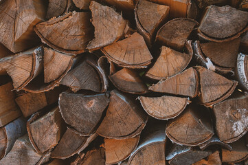 Natural wood texture with stack of chopped firewood