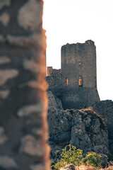 Italy, July 5, 2025: Ruins of Rocca Calascio Castle, an Italian tourist destination and landmark in the Gran Sasso National Park, L'Aquila, Abruzzo. Clear blue skies at sunset.