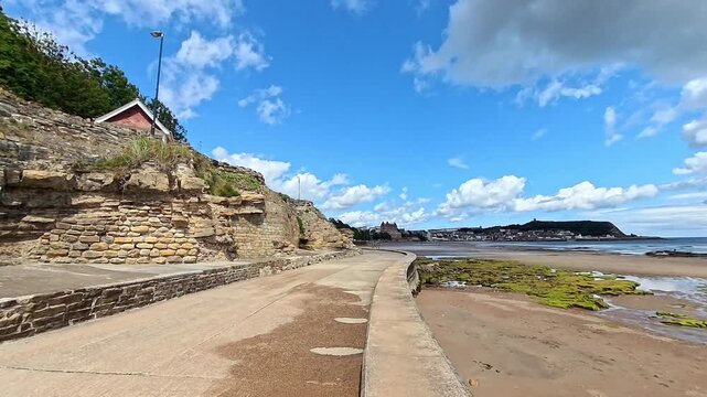 View down the promenade in Scarborough's South Bay on a bright and sunny summer day. Push in shot