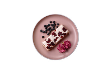 Nougat or white caramel with hazelnuts and pistachios and citrus pieces. White nougat with nuts