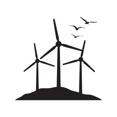 Silhouette of wind turbines and flying birds illustrating renewable energy and sustainable power