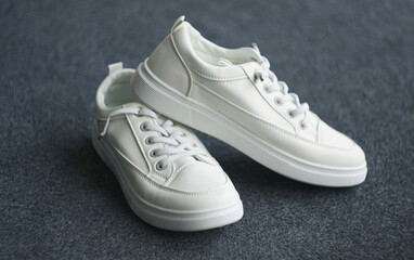 white sneakers are on top