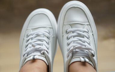 White sneakers on feet