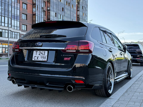 Subaru Levorg 2.4 STI Sport R EX 4WD black color parked on street. Exterior of a black Subaru WRX Wagon on parking lot. Subaru Levorg STI Sport EyeSight 4WD Japanese sport car. 