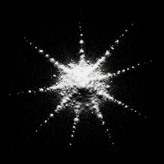 Abstract starburst of white particles on a dark black background