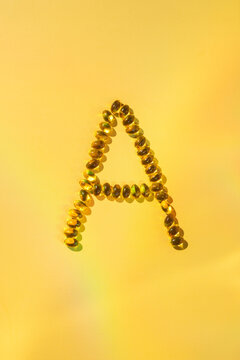 Softgel capsules arranged in letter A for health supplement