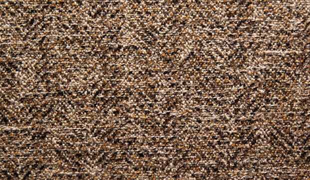 Dense brown textile with diagonal woven texture