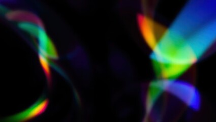 Blurred rainbow refraction overlay effect. Light lens prism effect on black background. Holographic reflection, crystal flare leak shadow overlay. Colorful rainbow disco ball light
