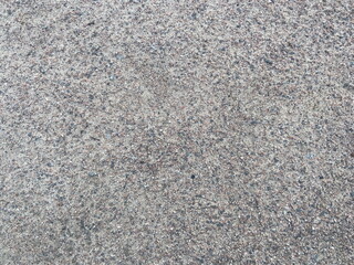 Close-Up Texture of Rough Granite Stone Surface in Neutral Gray Tones