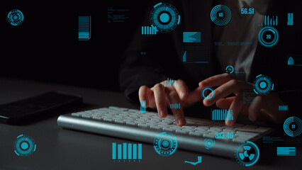 Hands typing on keyboard surrounded by glowing data visualization elements, representing technology...