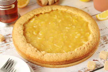 A tart with lemon marmalade served on the table	