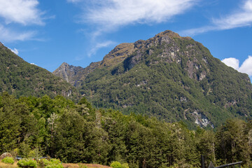 Lush Green Mountains Under Blue Sky