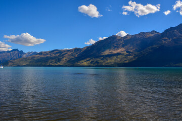 Serene Lake Surrounded by Majestic Mountains