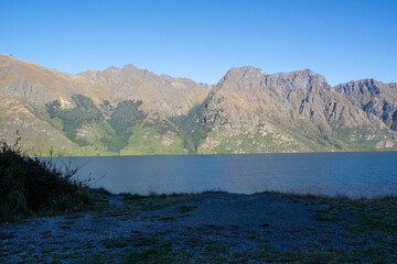 Serene Lake Surrounded by Majestic Mountains