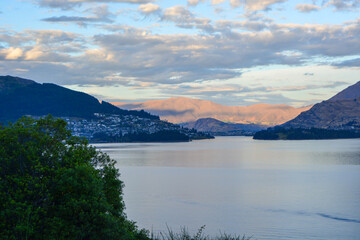 Tranquil Lake Landscape with Mountains and Clouds