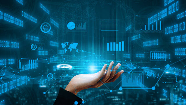 A futuristic hand gestures towards a glowing display of digital data, showcasing charts and a world map. Perfect for illustrating technology, data analysis, and innovation. Xenic